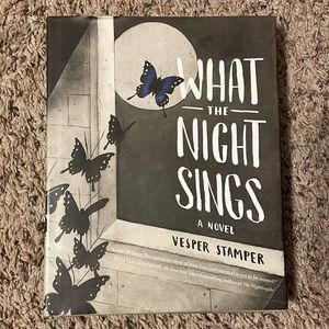 Brand new “What the Night Sings” novel by vesper stamper. Hardcover.